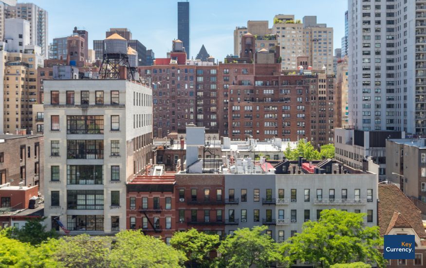 Overview photograph of apartment buildings in central New York on a sunny day.