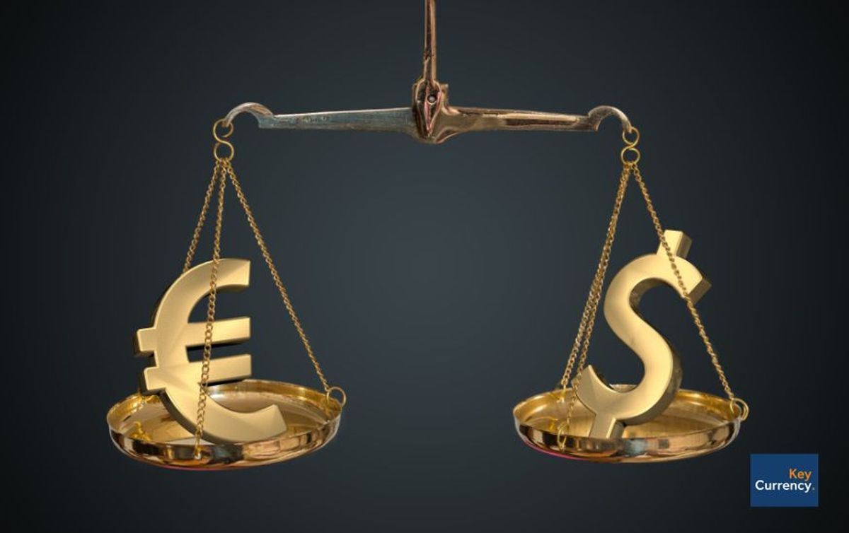A scale with gold Euro and Dollar symbols on either side to represent the ever changing exchange rate
