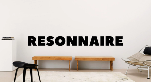 The Resonnaire logo over a photograph of modern furniture in front of a gray wall.