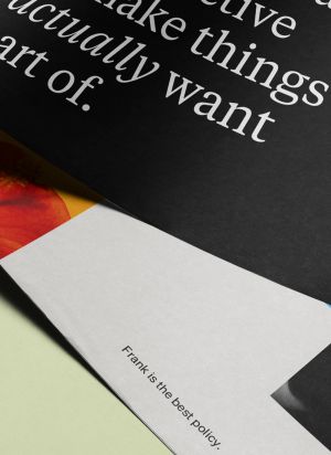 Printed collateral for Frank in a stack on a light green table