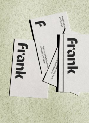 A handful of business cards with the Frank logo