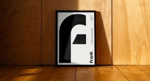 A poster of the Frank logo in a brightly lit room with wooden floors and walls