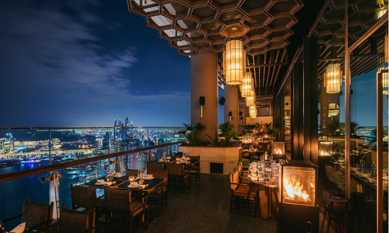 Restaurant terrace overlooking Dubai skyline in night time