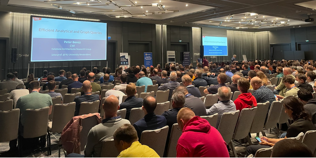 Packed audience watching keynote speech