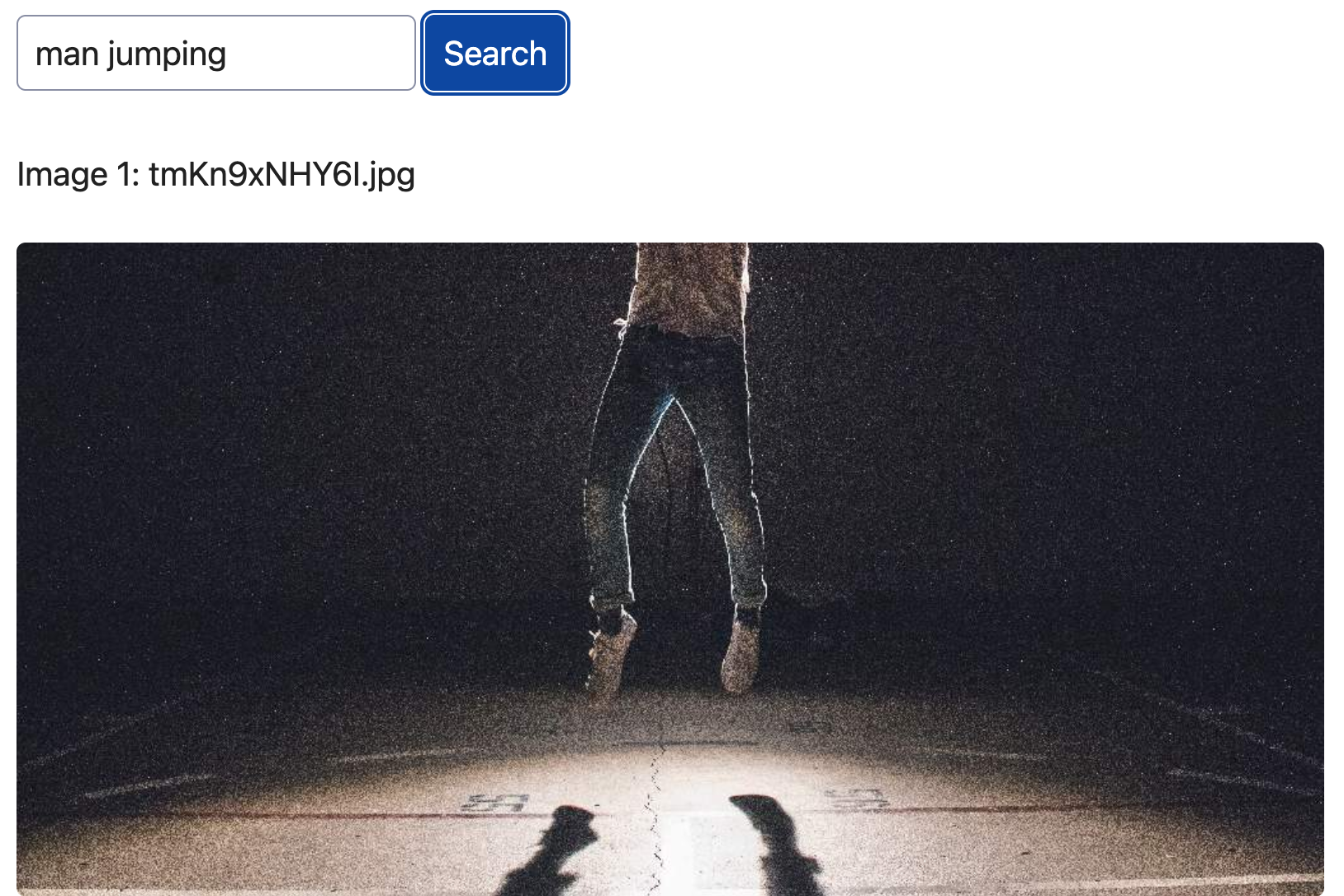 The web app, showing the query "man jumping" and the first image result, which is indeed a picture of a man jumping, or at least his bottom half