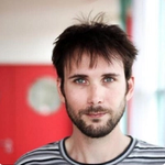 A picture of Mathieu Anderson. He has brown hair and blue eyes and a beard.