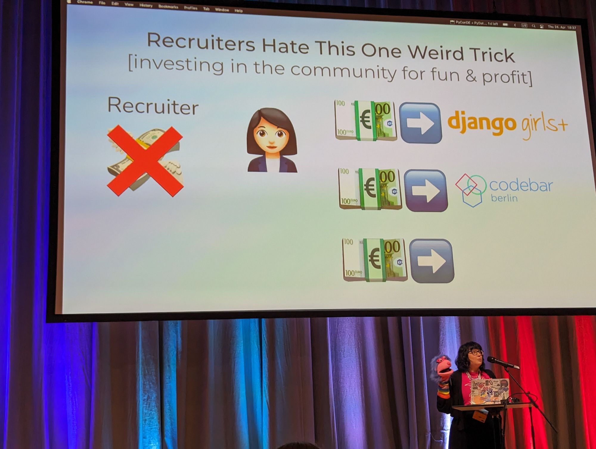 Lisa Quatmann's presentation on why investing in the community is a useful thing to do. Playfully, she was given a sock puppet to present with.