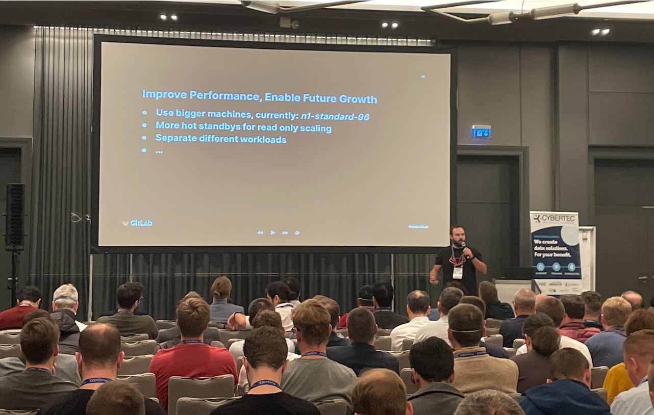 Audience watching GitLab speaker present