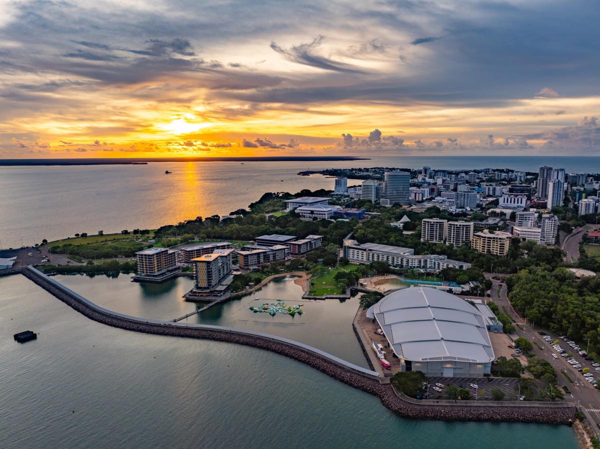 Aerial view of Darwin's waterfront precinct at sunset with the city skyline, convention centre and harbour, Northern Territory.