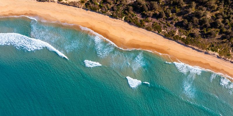 CASA-licensed drone in flight over Australian landscape - commercial aerial photography