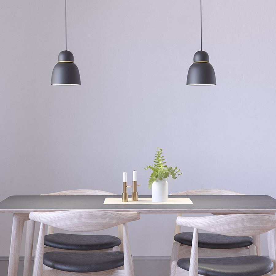 Two pendants in black over att kitchen table 