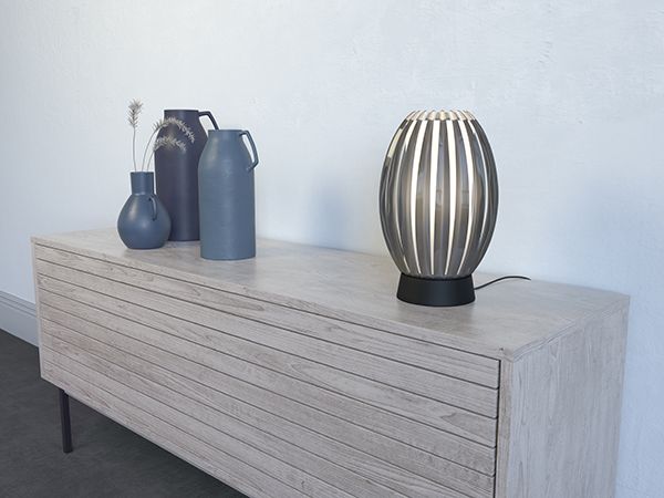 Black table lamp on sideboard