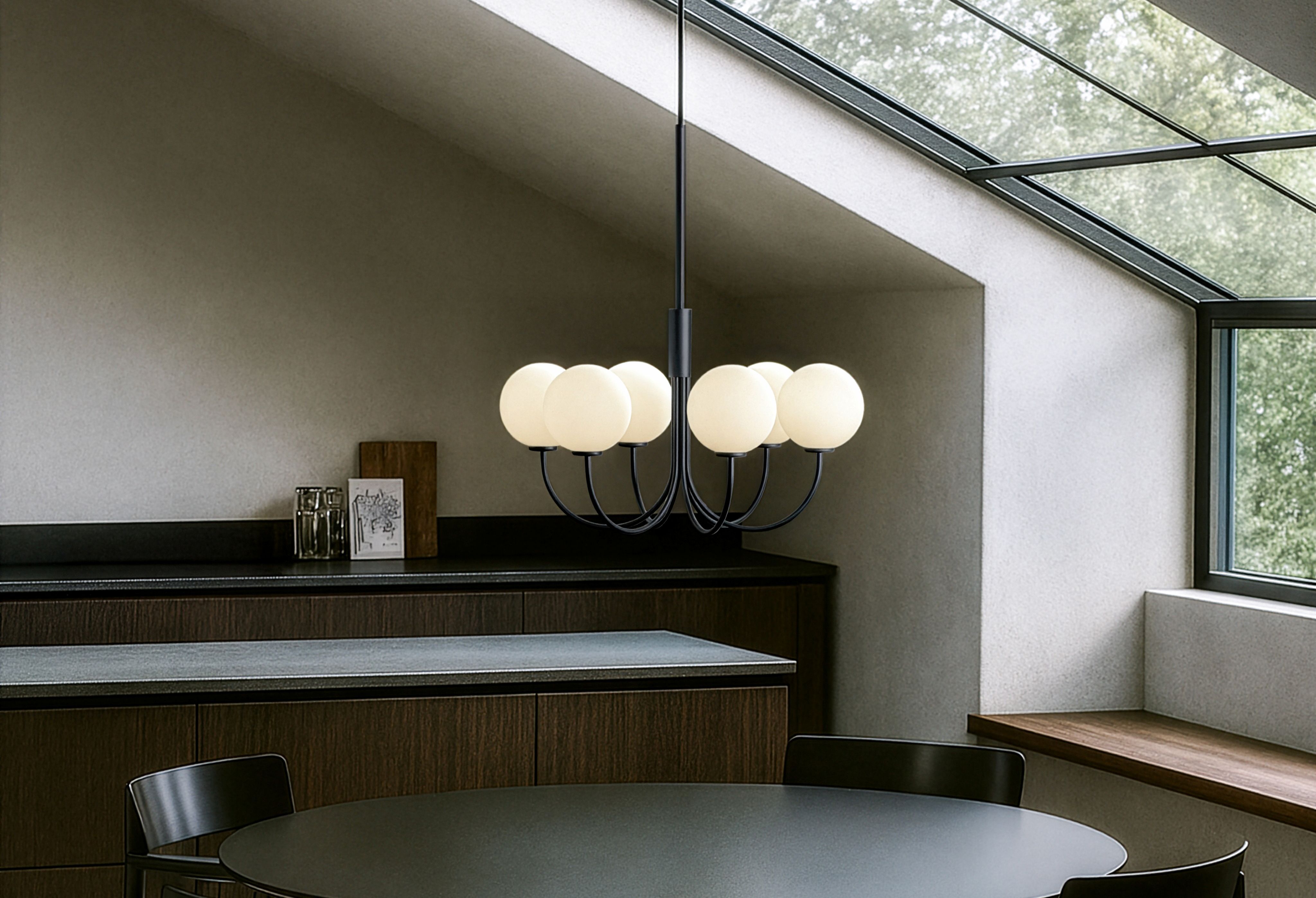 Black chandelier over at kitchen table