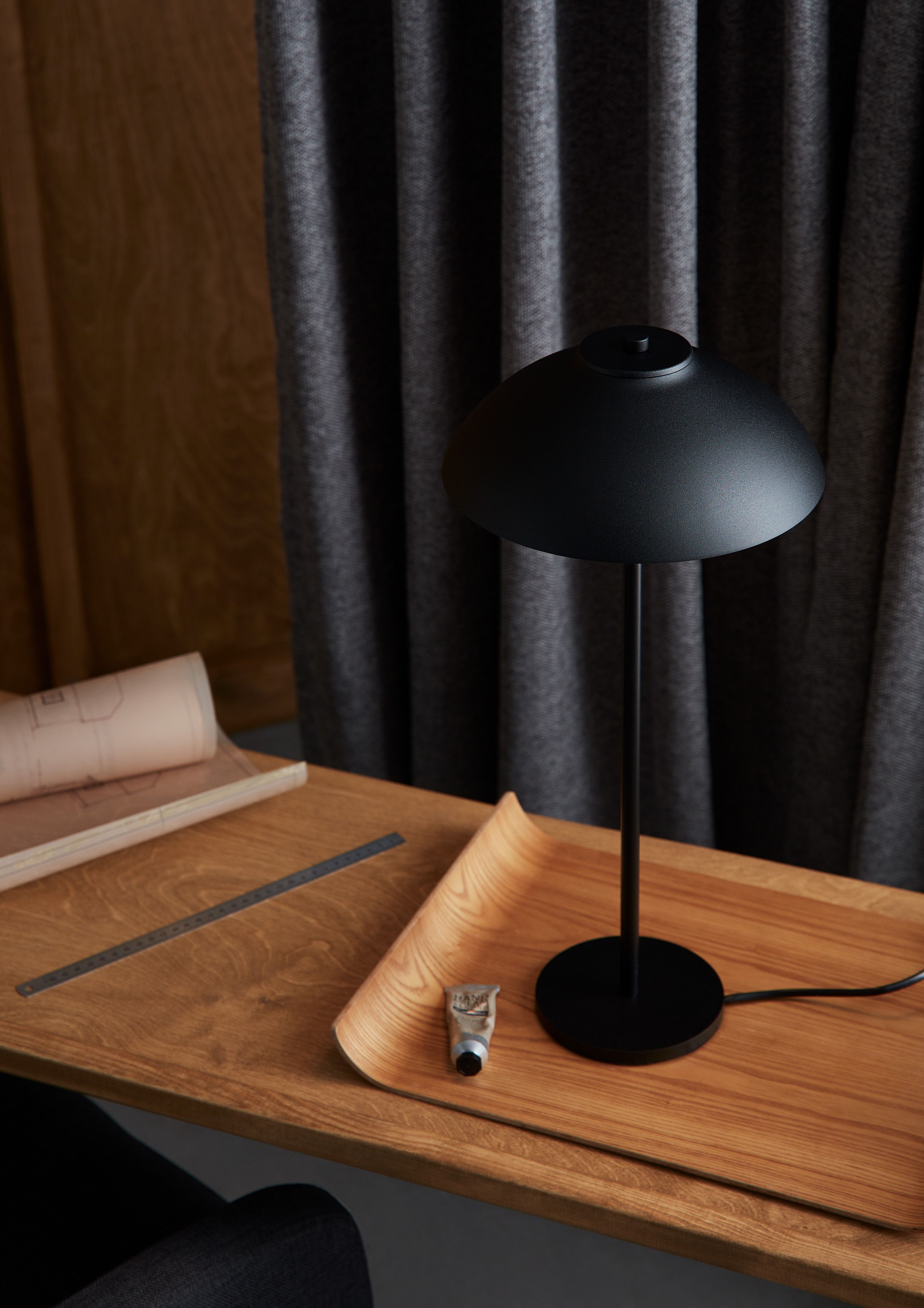 Black table lamp on a work desk