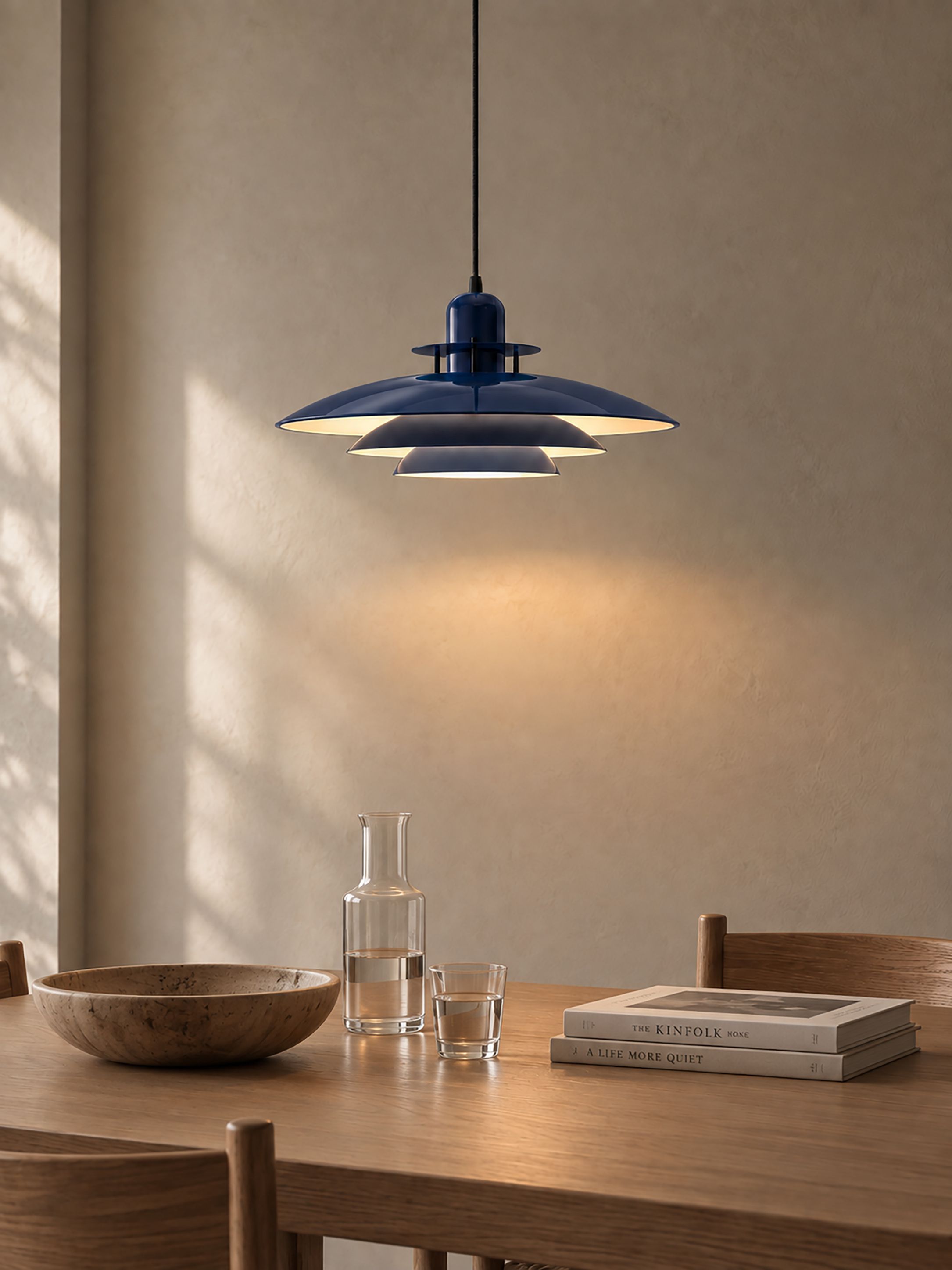 Primus I pendant deep blue and flat black over a dining table