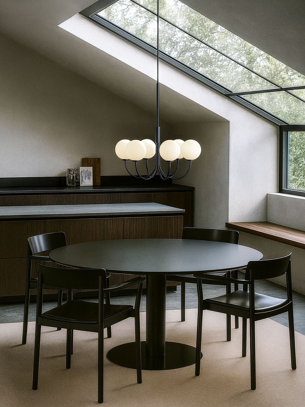 Ballon Chandelier in black and opal glas over a dining table