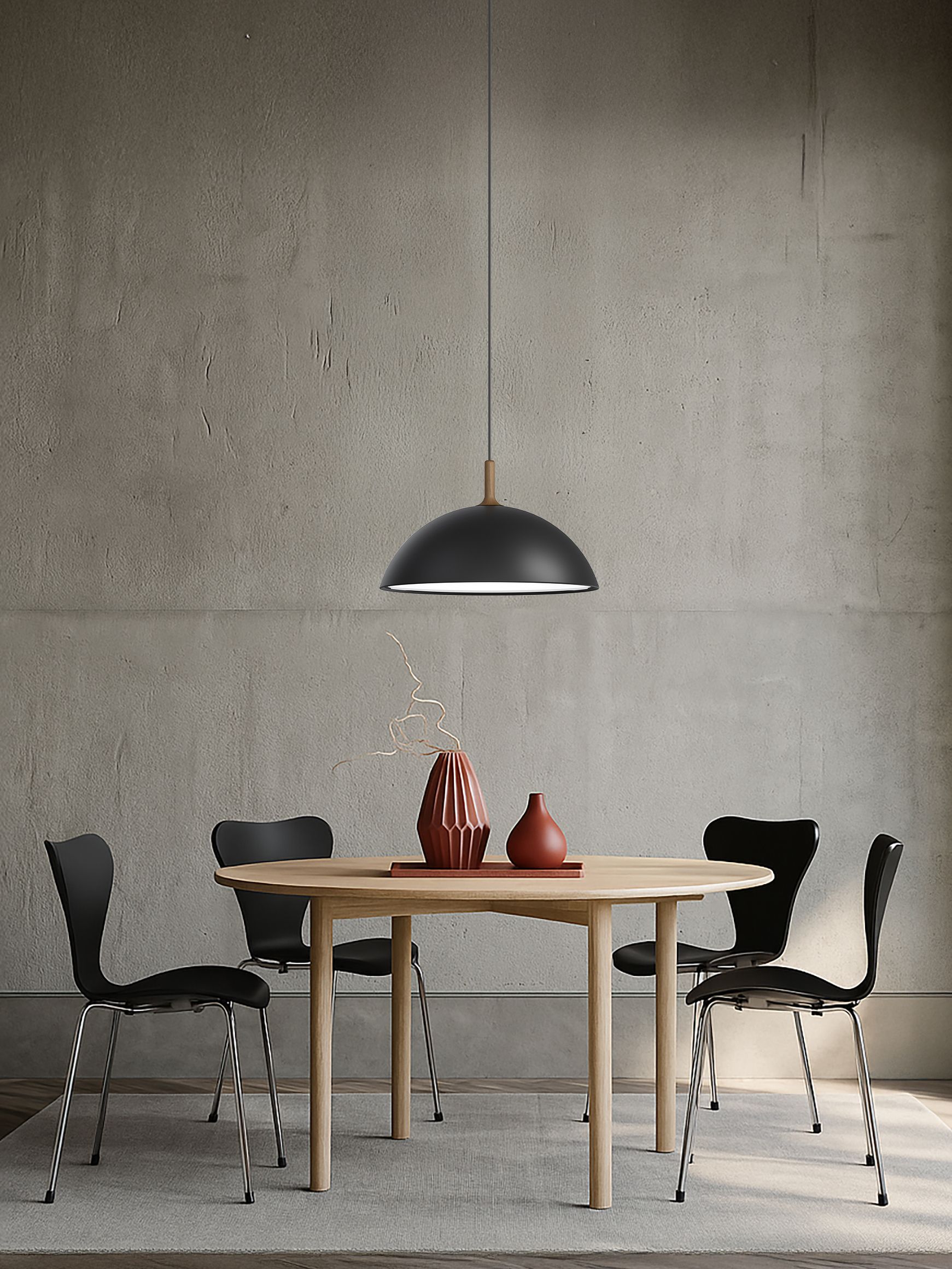 Black pendant over a dining table