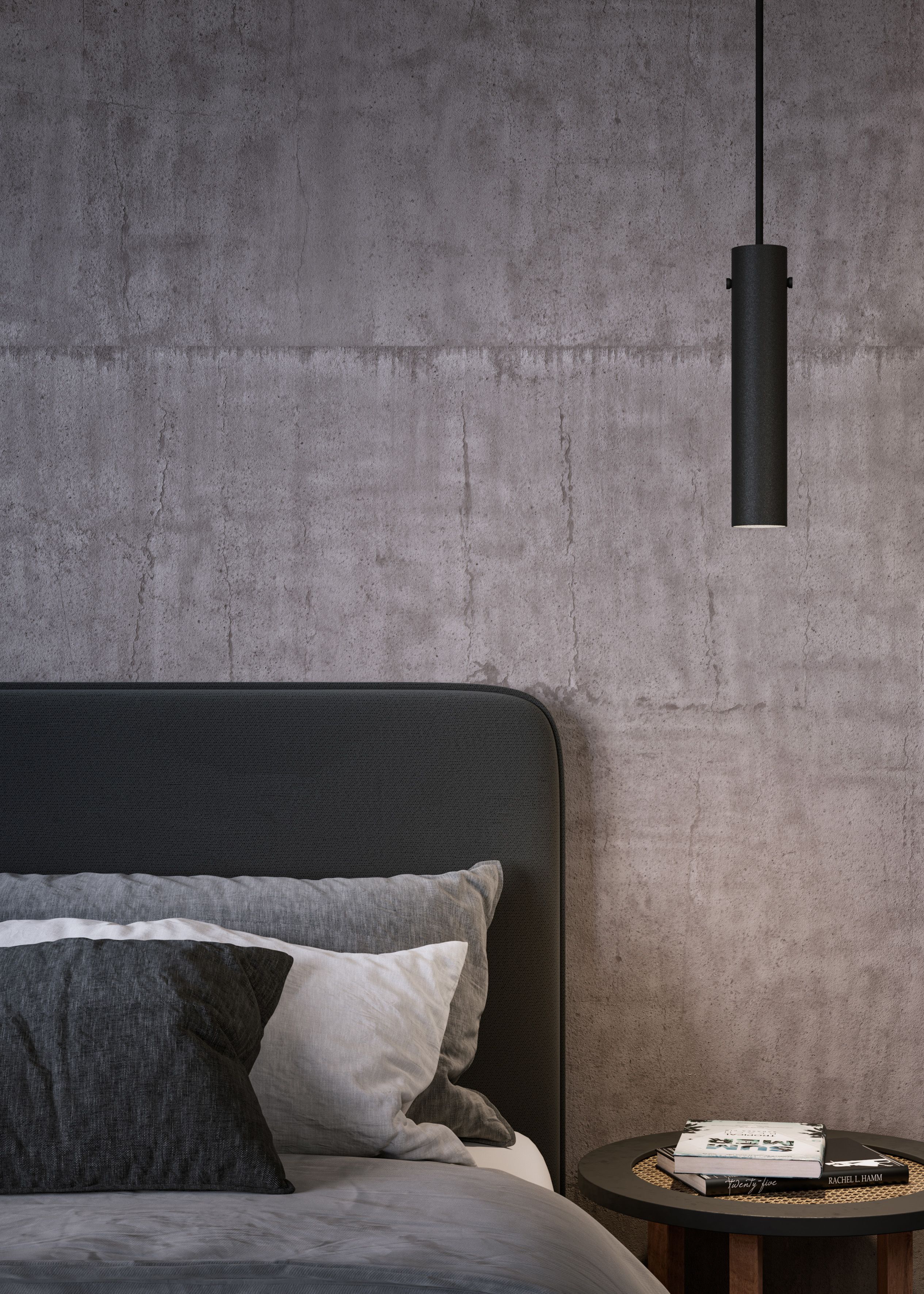 Black pendant beside the bed 