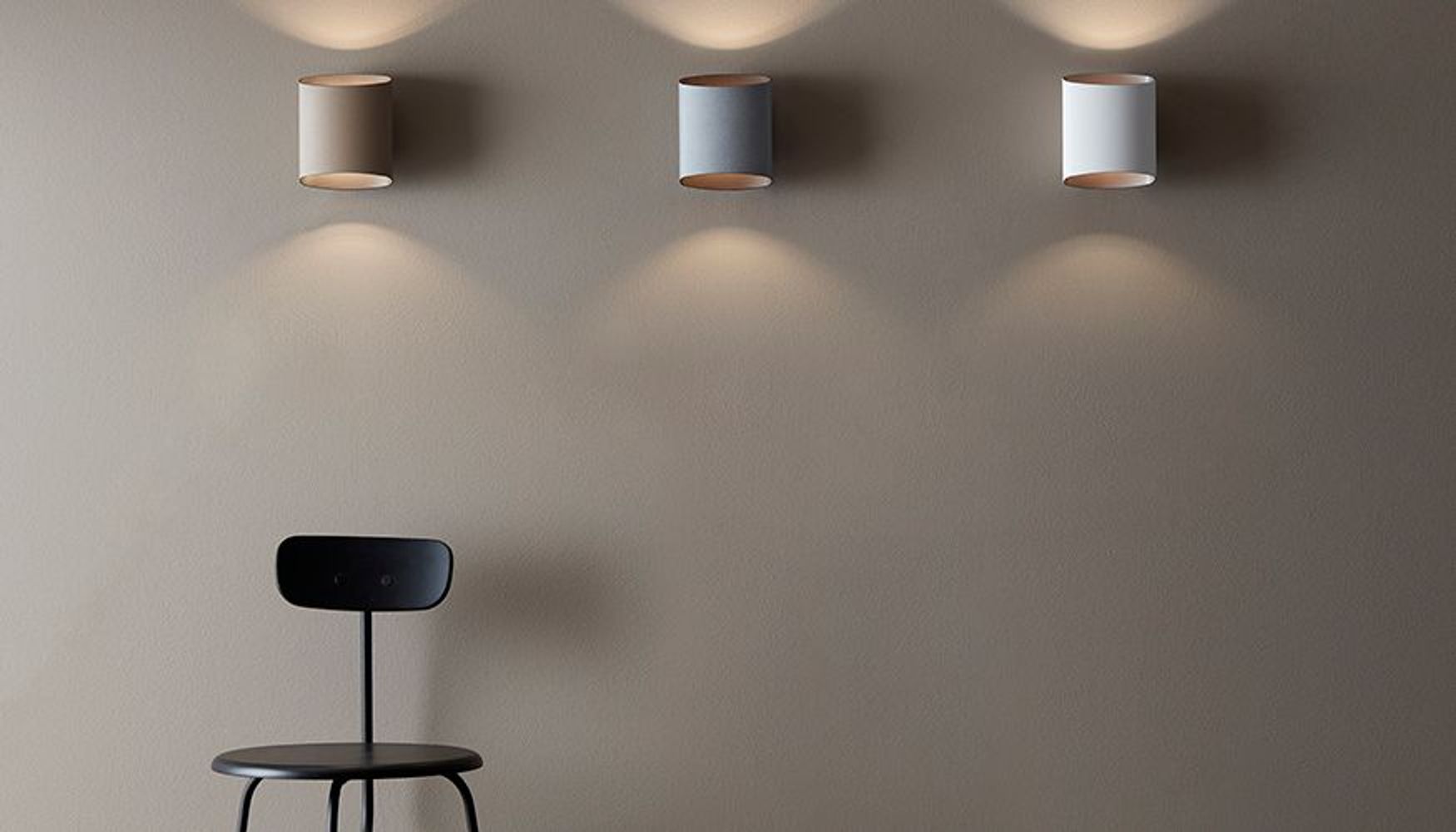 Three Signe wall lamps