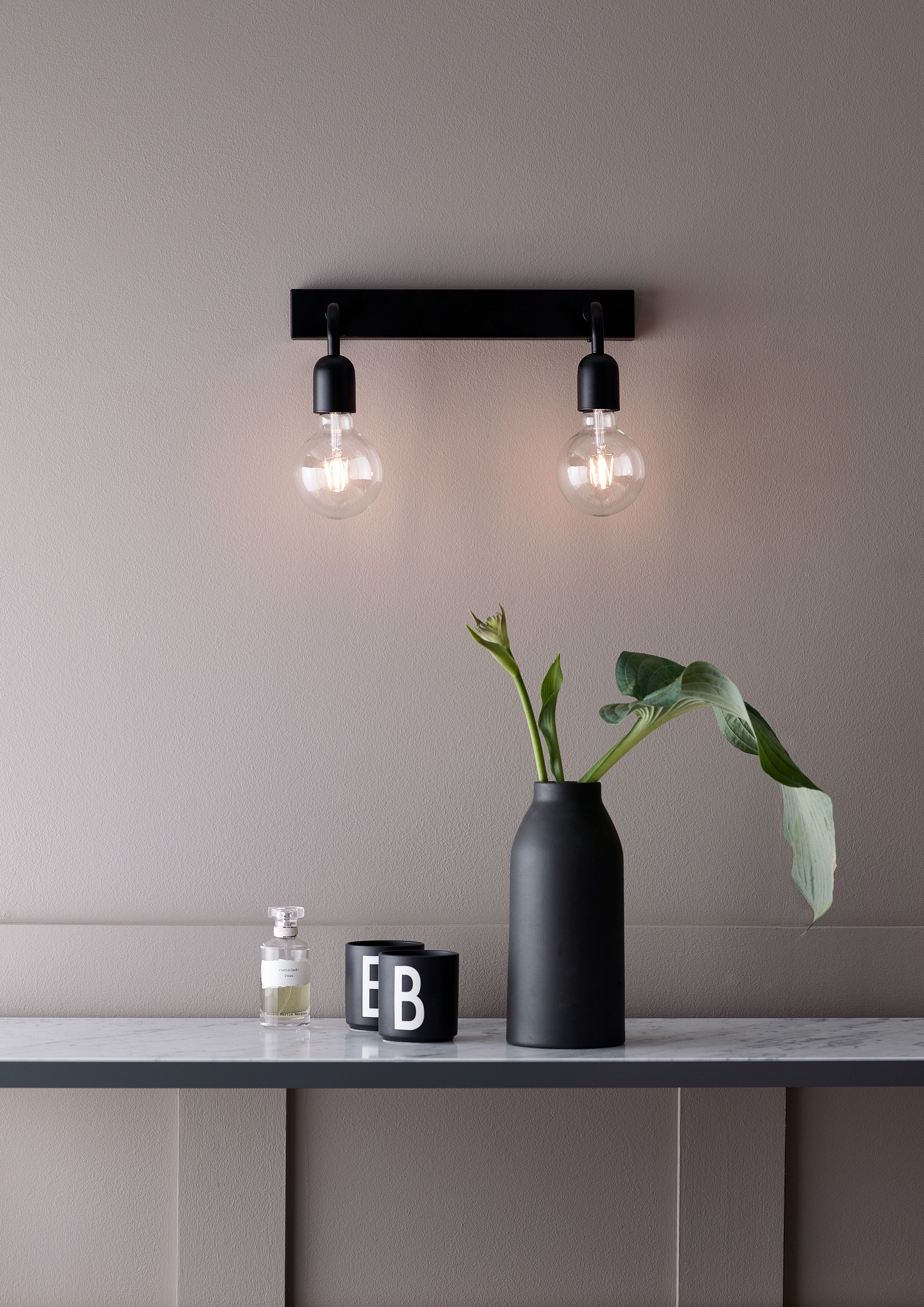 Black wall lamp in the bathroom 