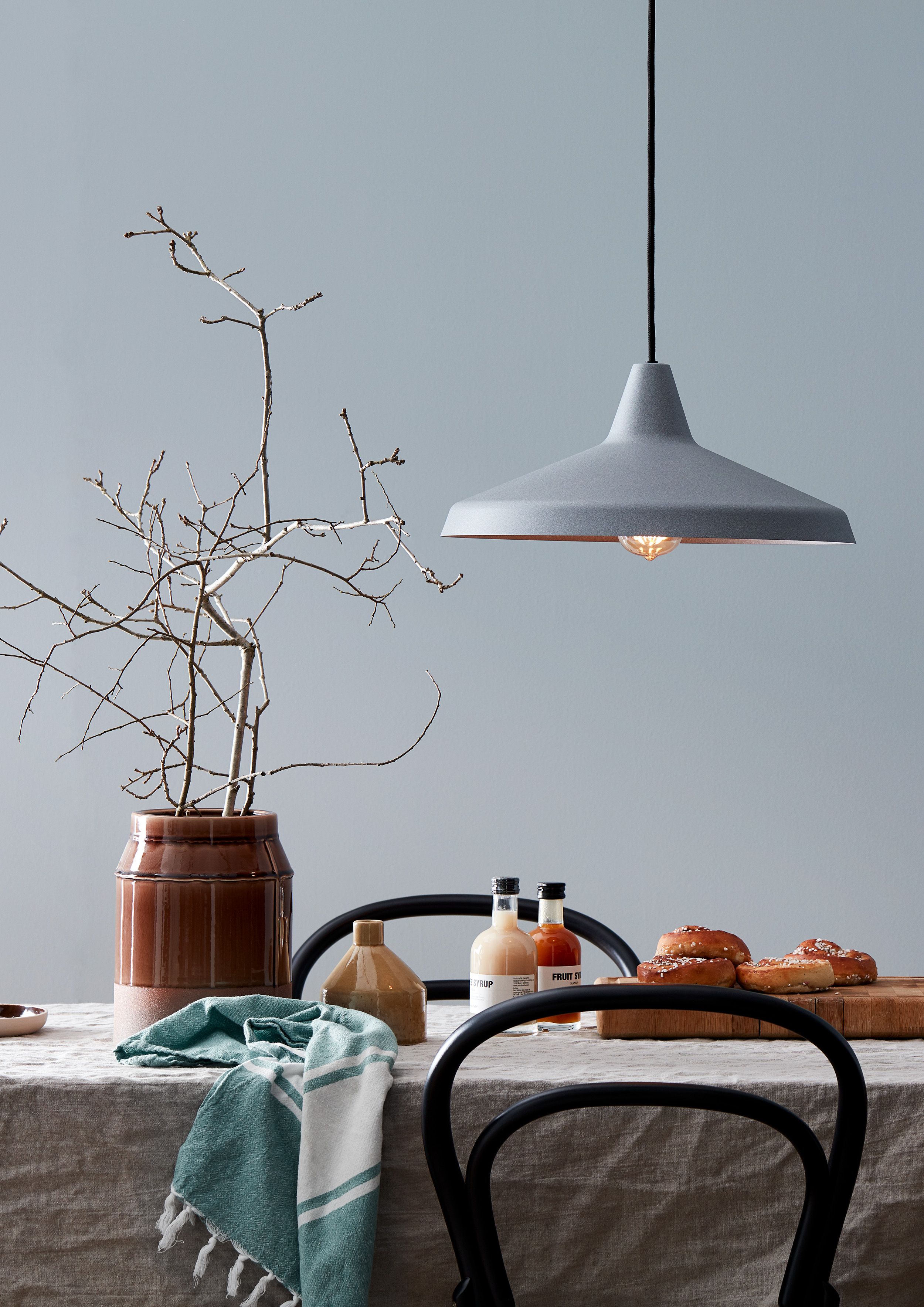 Grey pendant over kitchen table