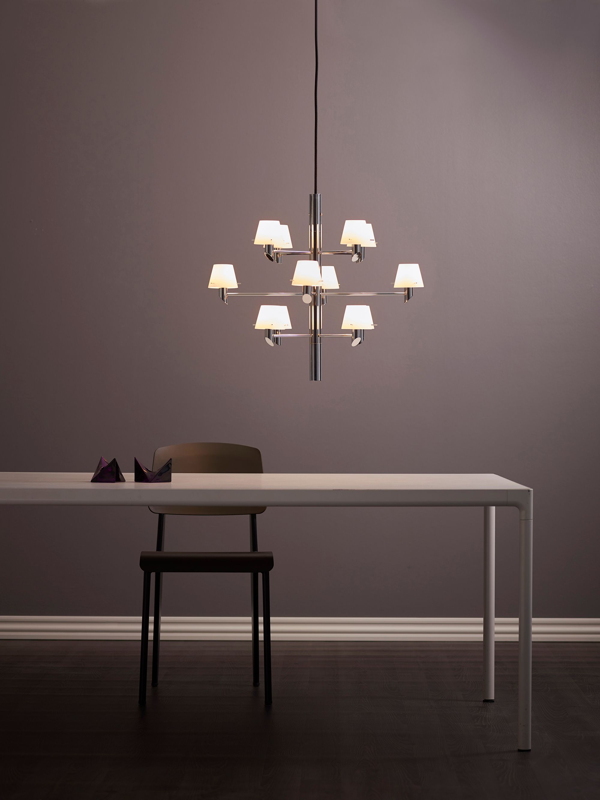 Gil Chandelier 12 chrome/opal glass over a table