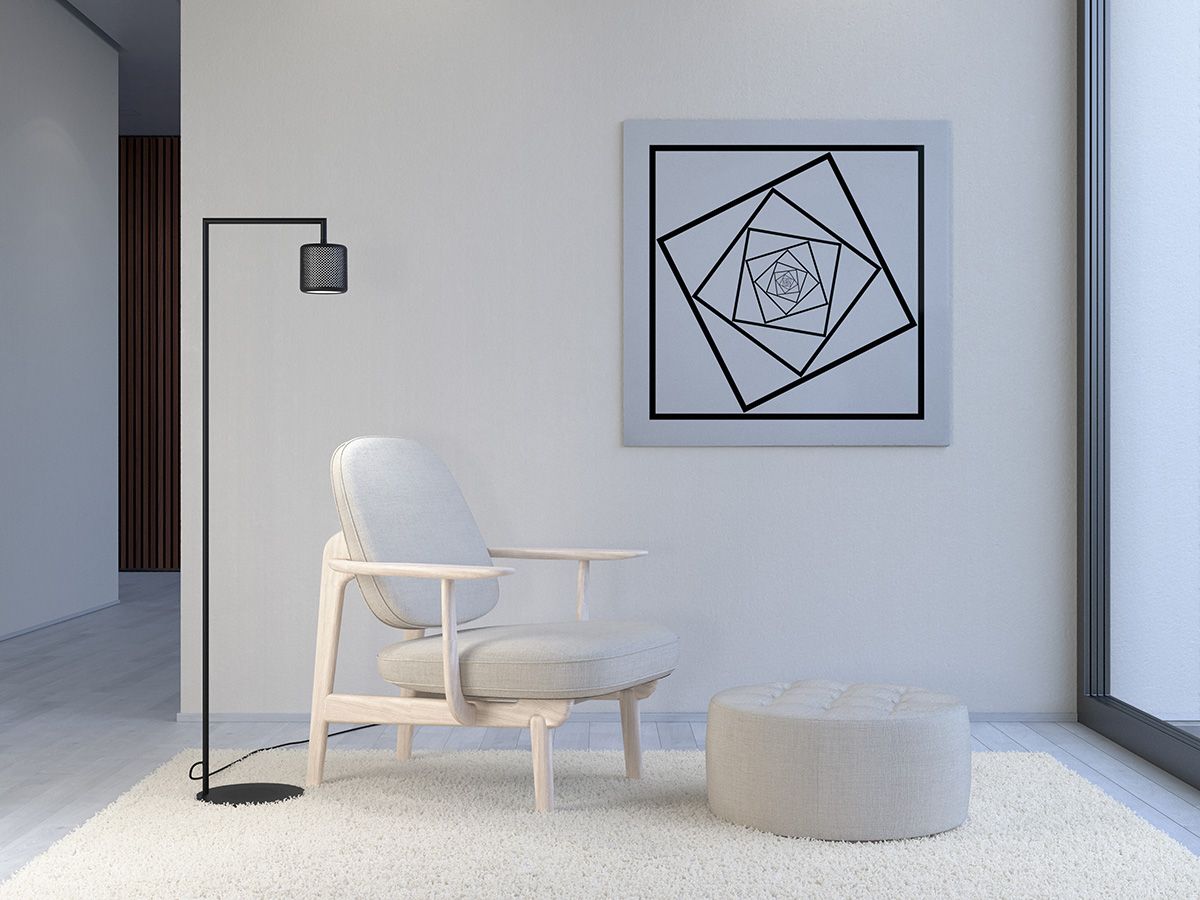 Black floor lamp beside chair