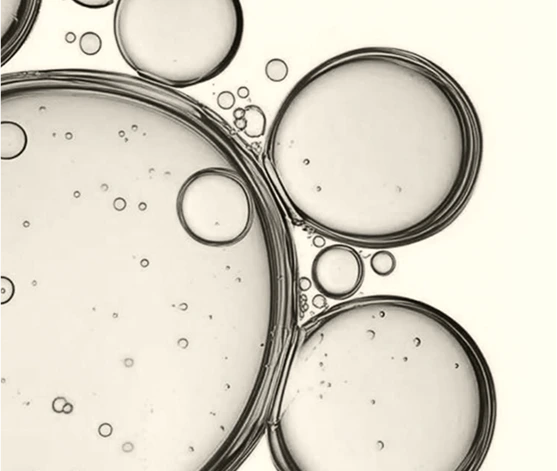 Drops of oil under a microscope representing Plantkos science