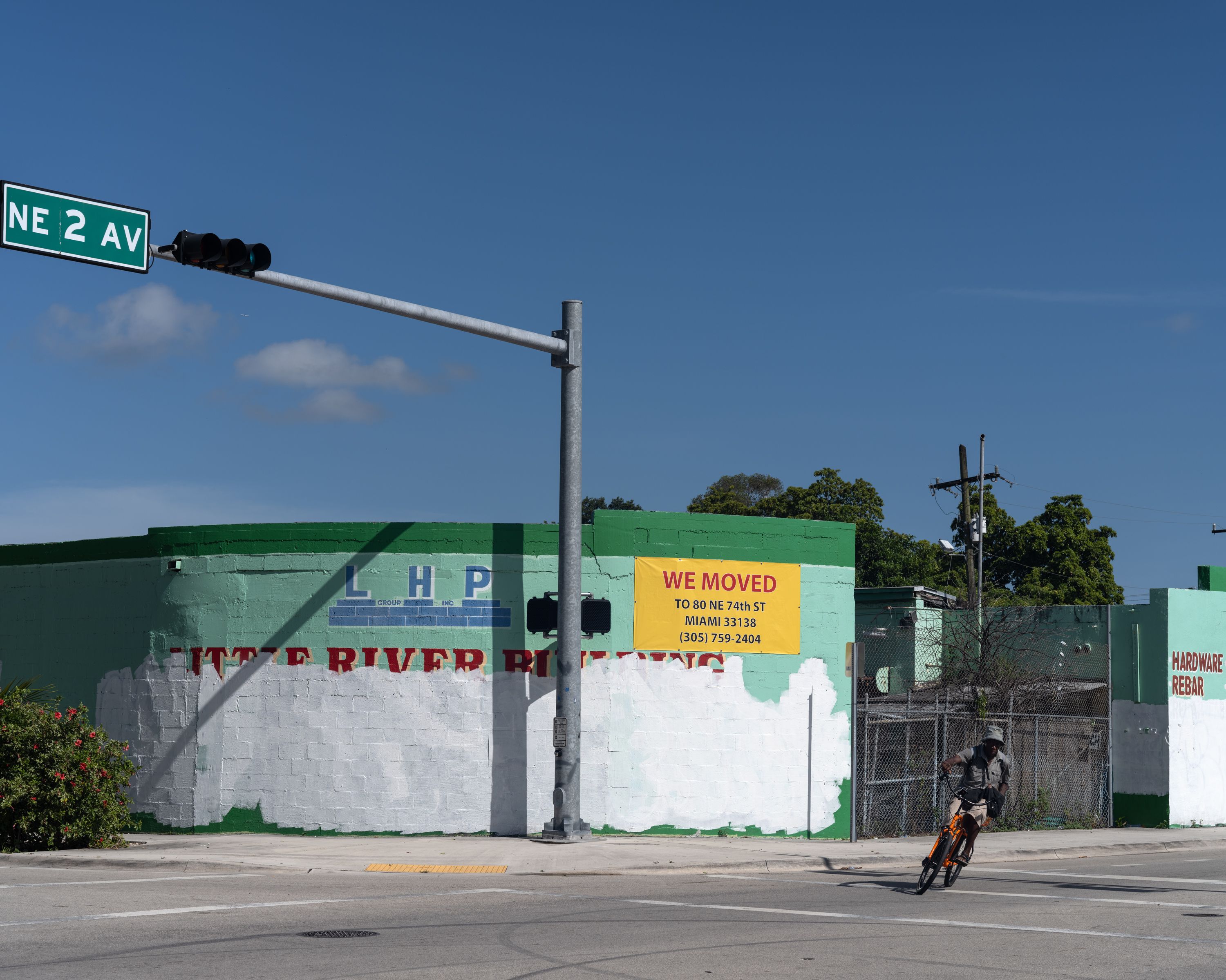 A solitary bicycle stands at the intersection of NE 2nd Ave and NE 78 St in Little Haiti, Miami. An empty street stretches...