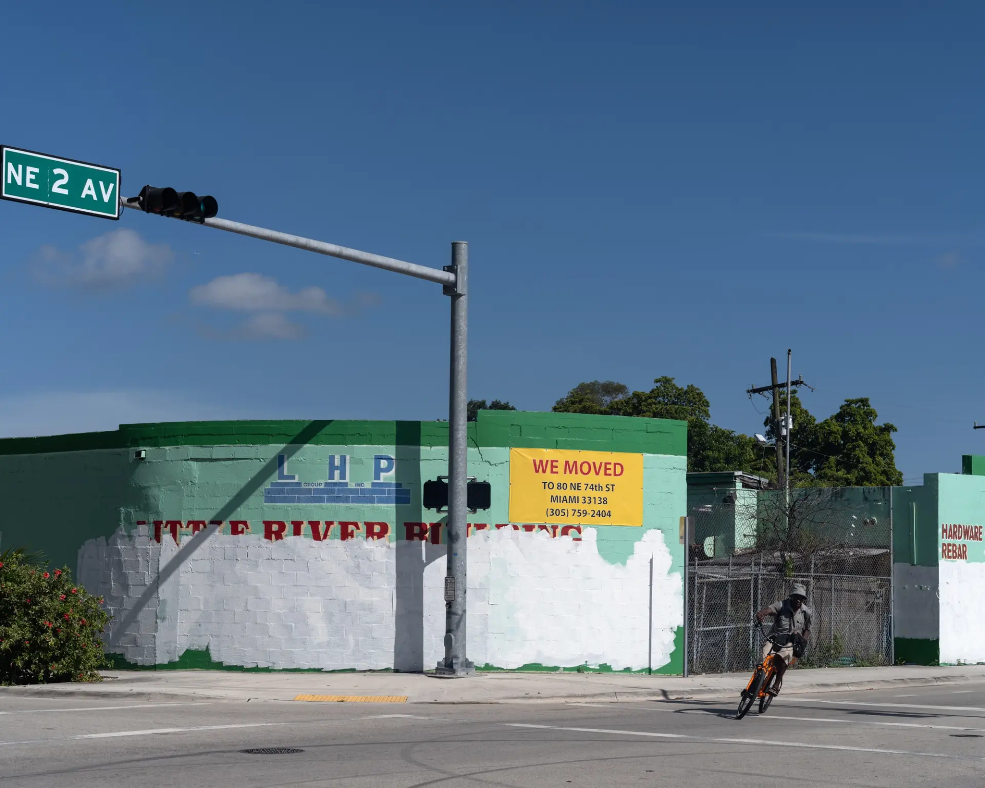 A solitary bicycle stands at the intersection of NE 2nd Ave and NE 78 St in Little Haiti, Miami. An empty street stretches...