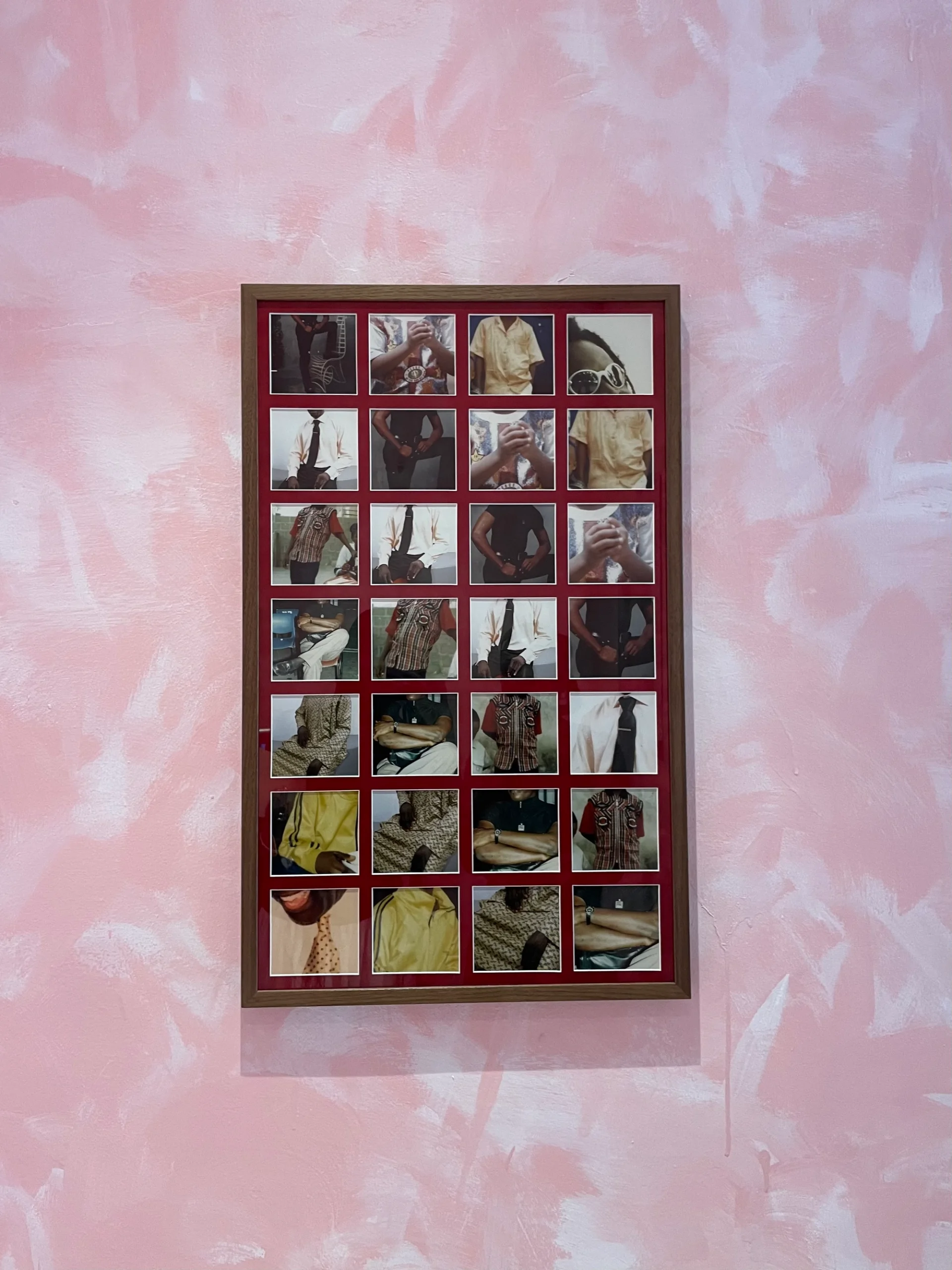 A framed photo grid featuring close-up portraits and fashion details on a pink-painted wall.