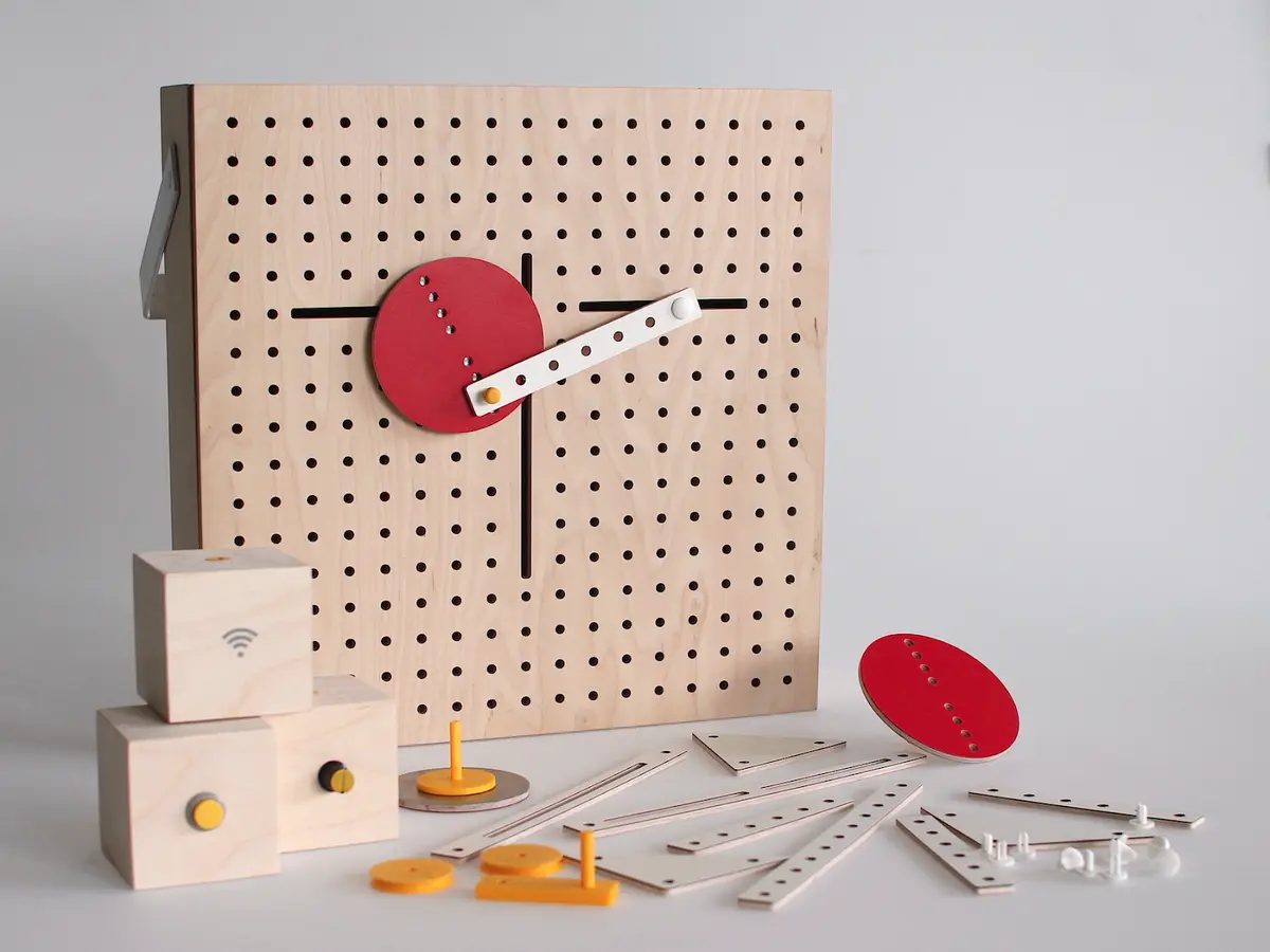 A wooden pegboard holds an array of distinct components well-organized on its surface, demonstrating various elements of the 2020 project, "Radical Soft Robots" by Eun Young Park.