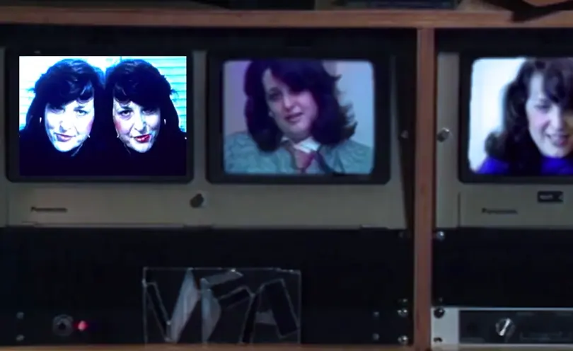An image from "Electronic Diaries" featuring Lynn Hershman on a dated electronic device with a background full of retro co...
