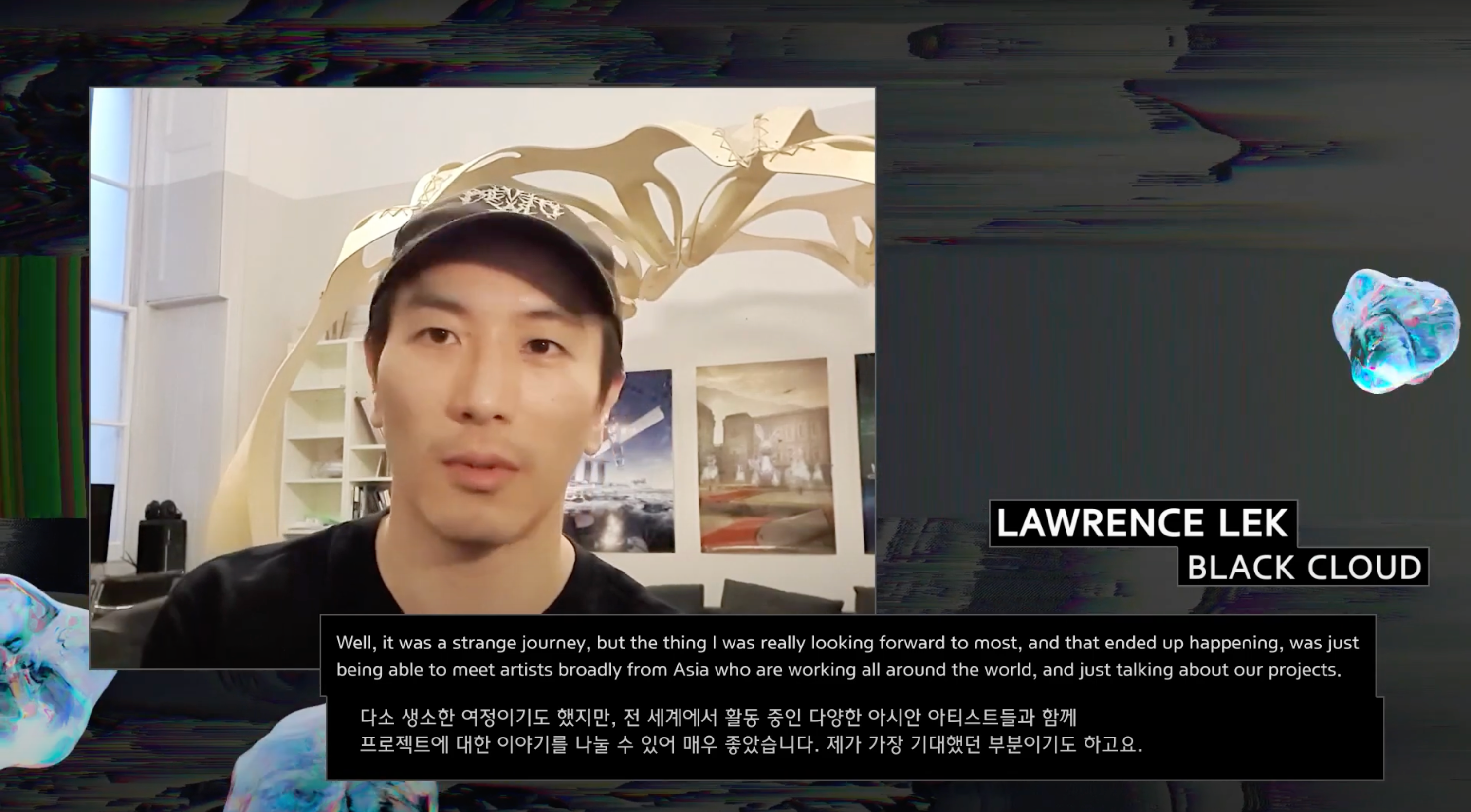 An individual interacting with the camera, behind them is a large caption featuring an interview excerpt from artist Lawre...