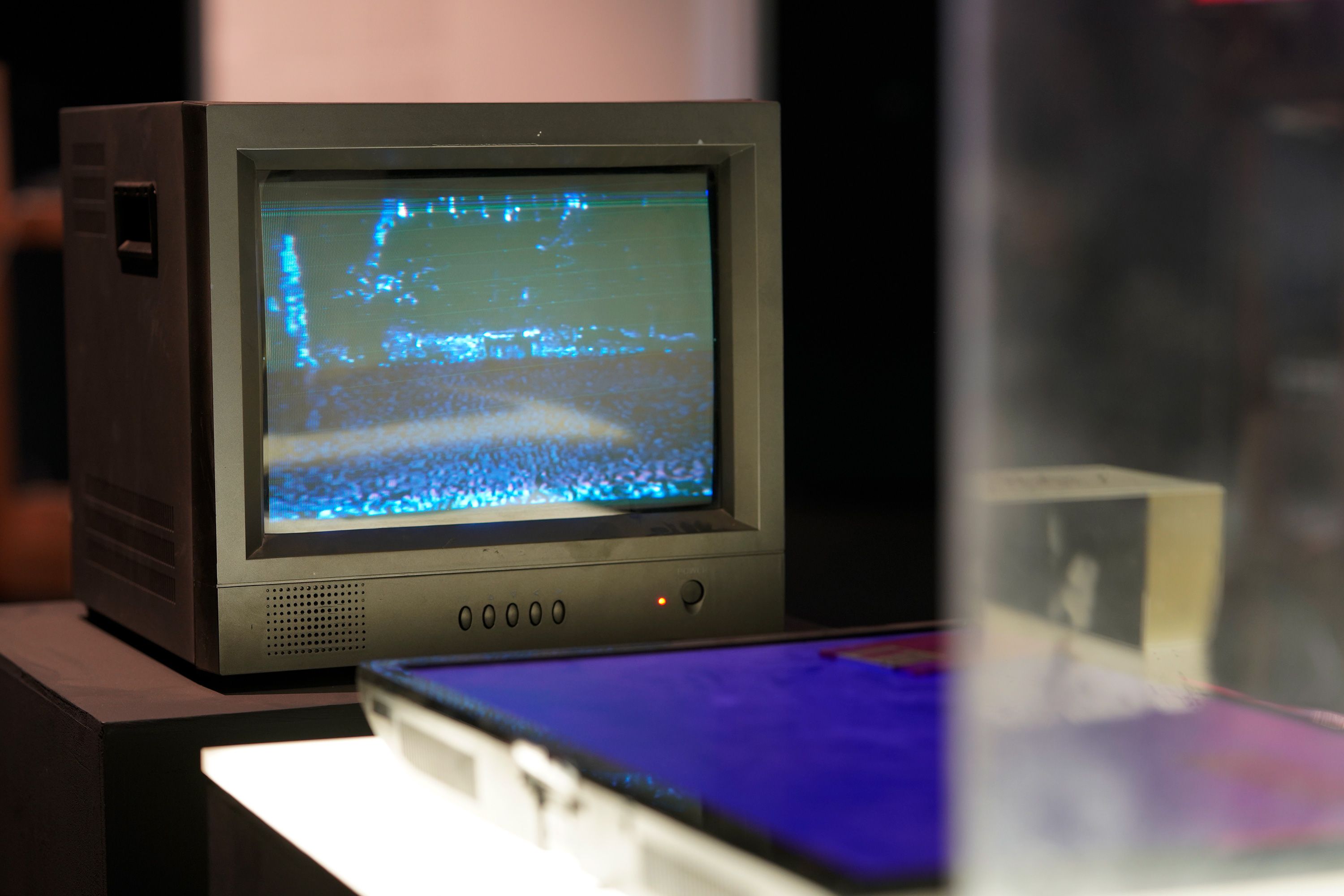 An old, vintage RV navigating device situated on a wooden desk, captured in sharp focus.