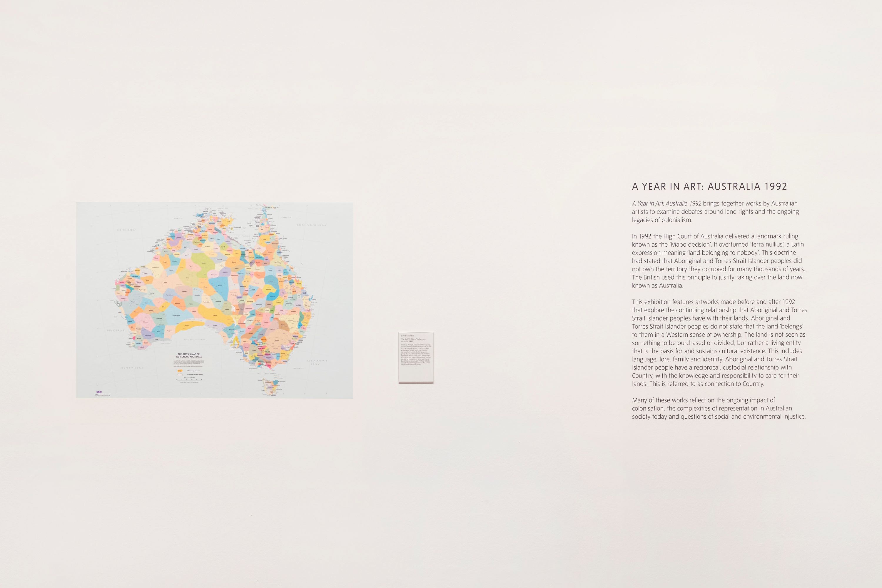 A detailed map of Australia and accompanying paragraphs of text displayed on a posterboard.