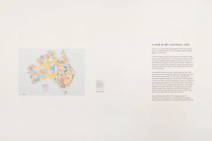 A detailed map of Australia and accompanying paragraphs of text displayed on a posterboard.