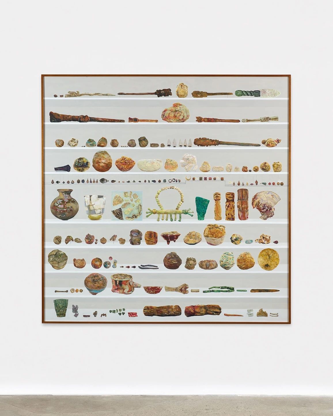 A large artwork showcasing an array of animal-shaped pottery and figurines arranged in rows.