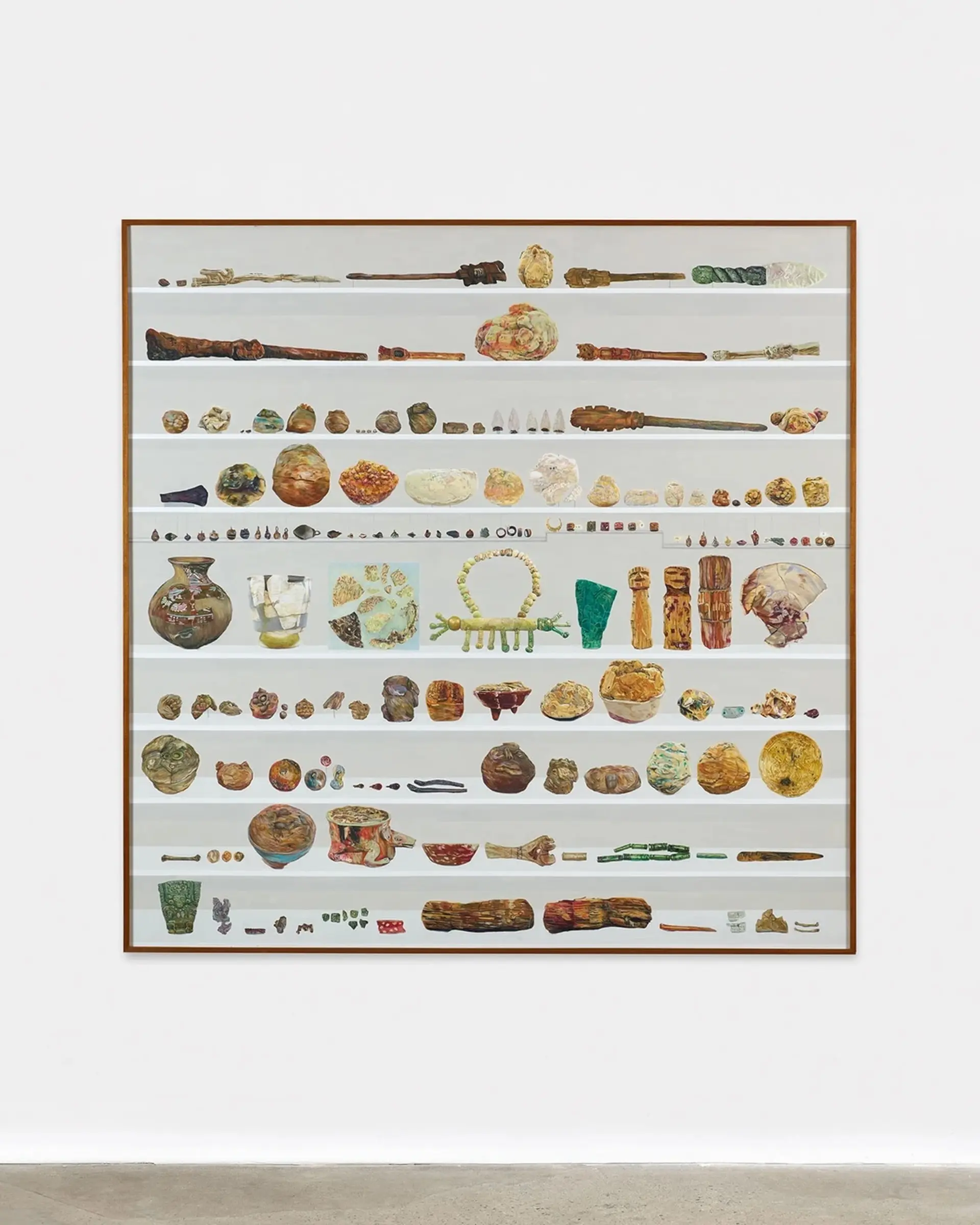 A large artwork showcasing an array of animal-shaped pottery and figurines arranged in rows.