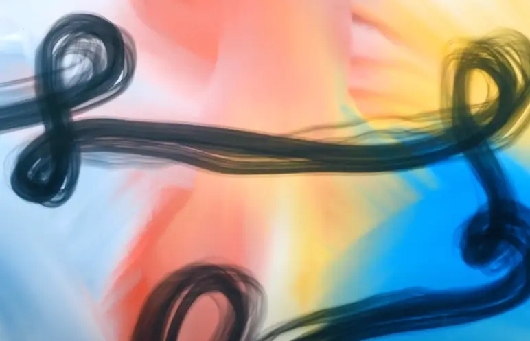 A vividly colorful background with strokes of blues, pinks, and yellows, overlaid with complex, abstract black lines that ...