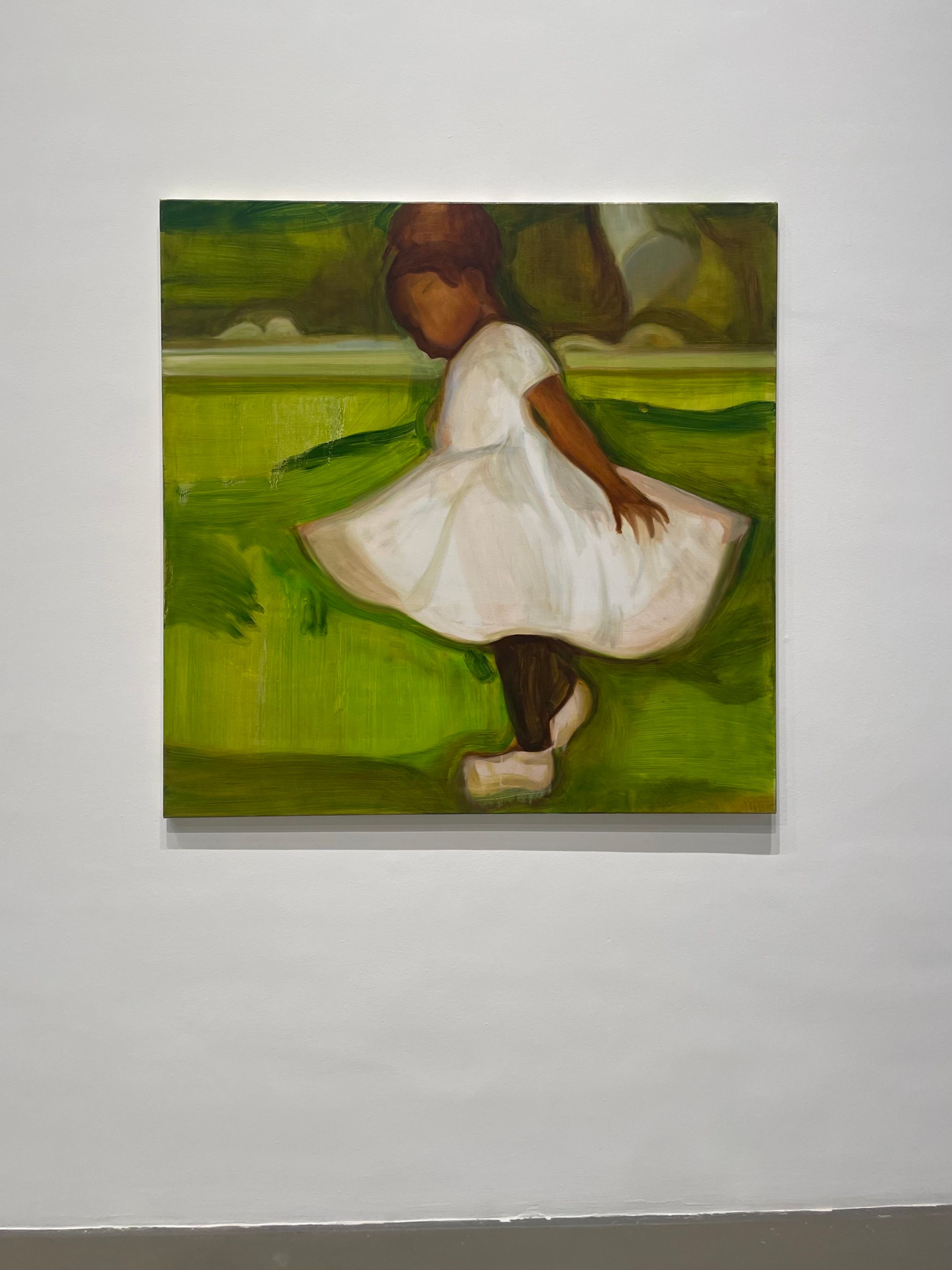 A painting of a young girl in a white dress on lush green grass.