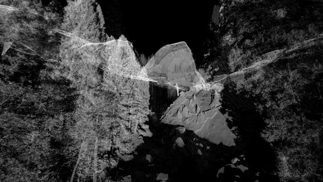 A black and white photographic composition featuring abstract shapes and forms that resemble rocky landscapes. Wispy lines...