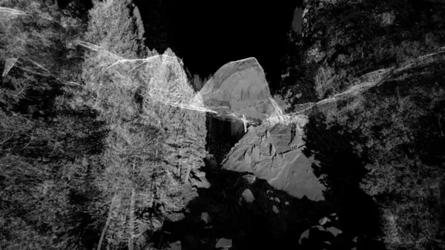 A black and white photographic composition featuring abstract shapes and forms that resemble rocky landscapes. Wispy lines...