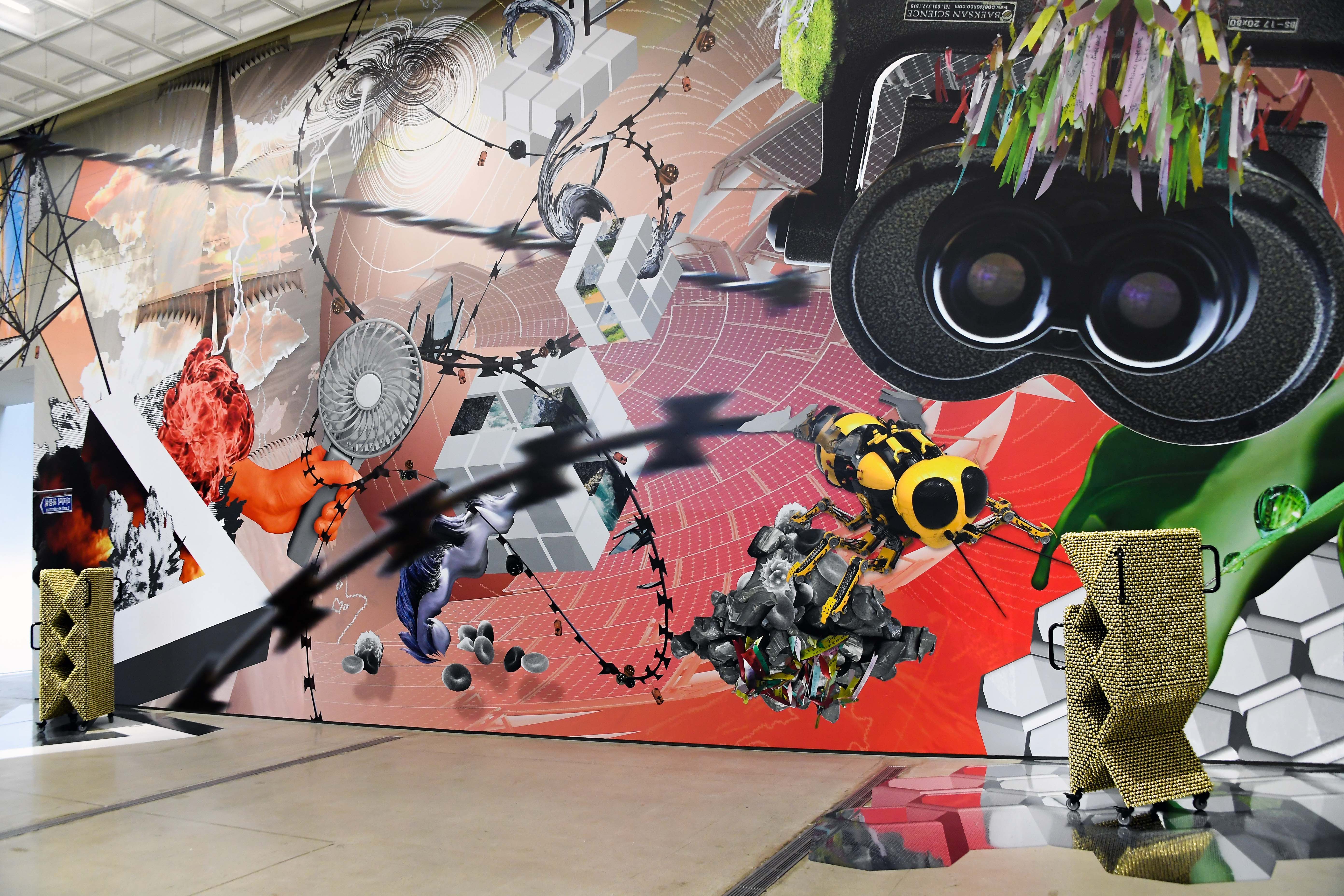 A vibrant wall graphic displaying various illustrated objects such as a robotic wasp, binoculars, an exploding plane, and ...
