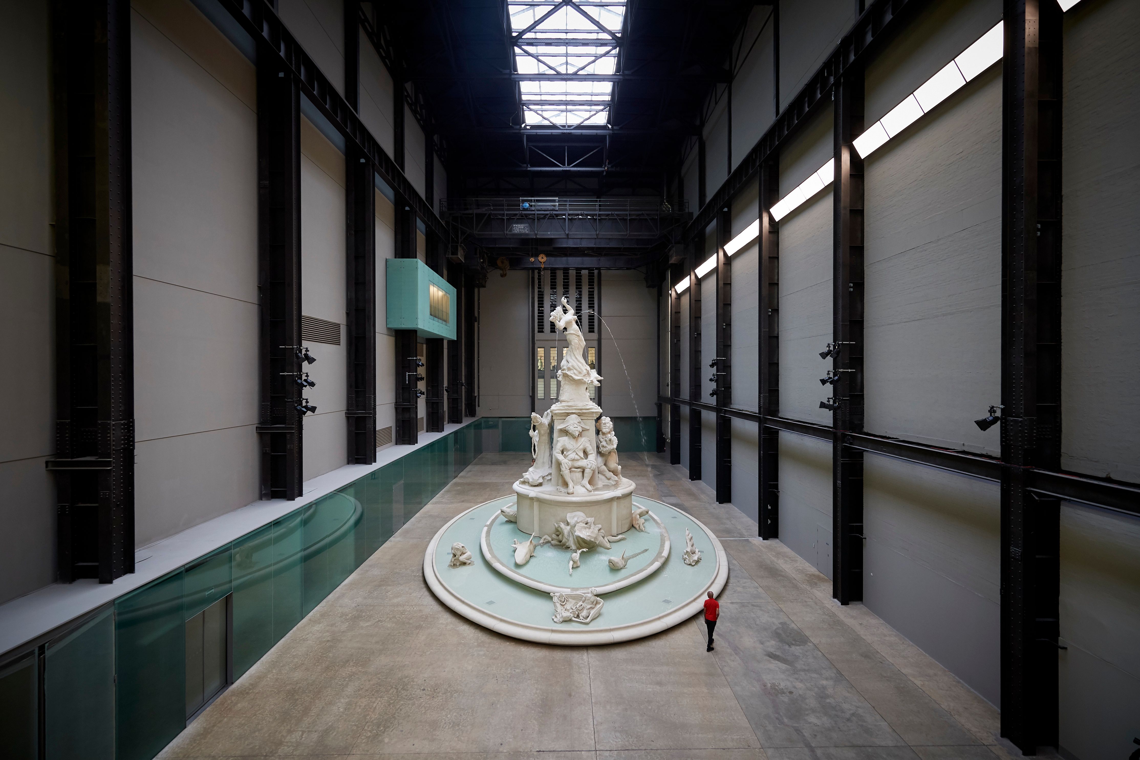 A three-tiered sculpture, with the bottom level depicting the sea, the middle showcasing pirates, and the top featuring a ...