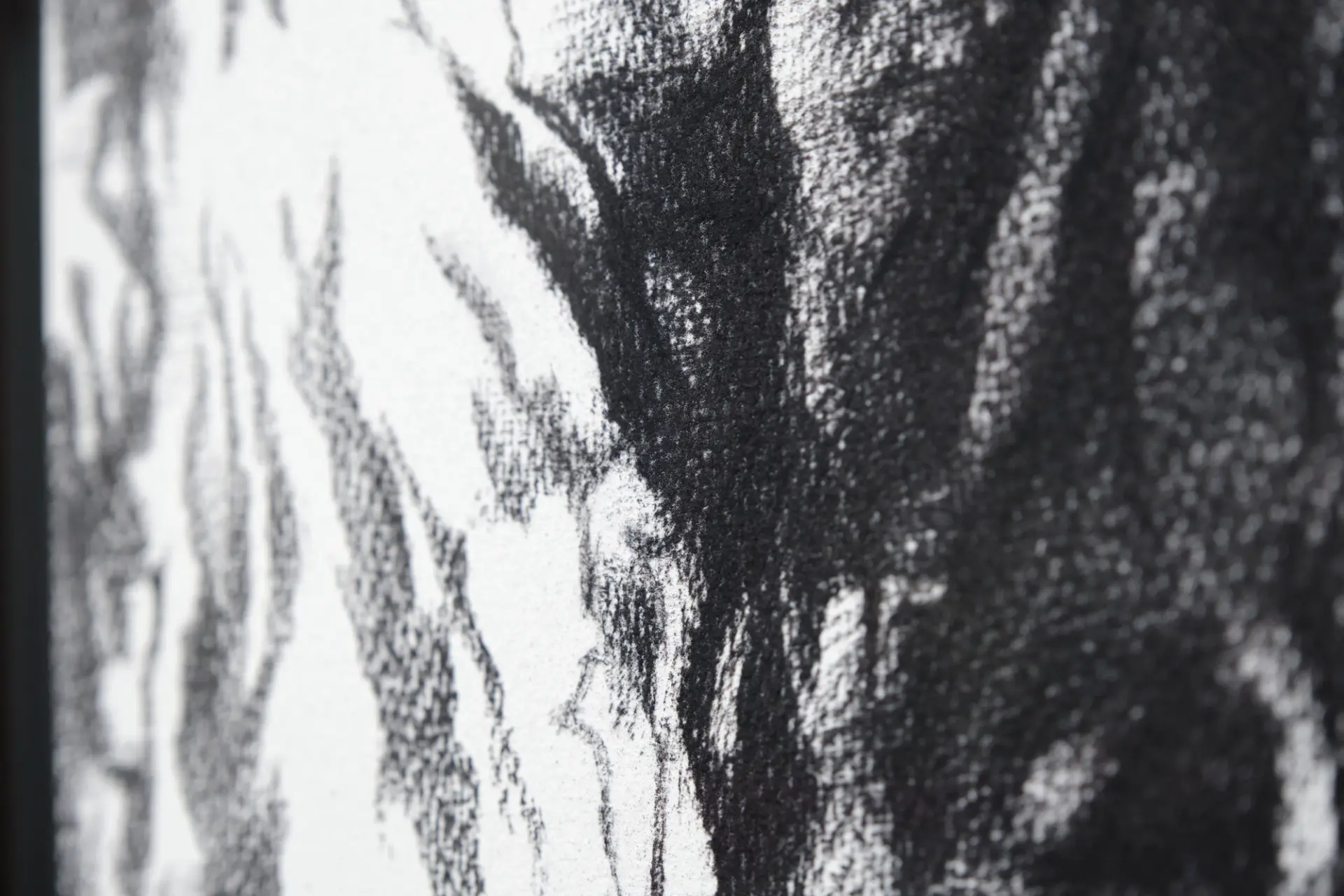 Detailed close-up of the textured black and white abstract drawing.