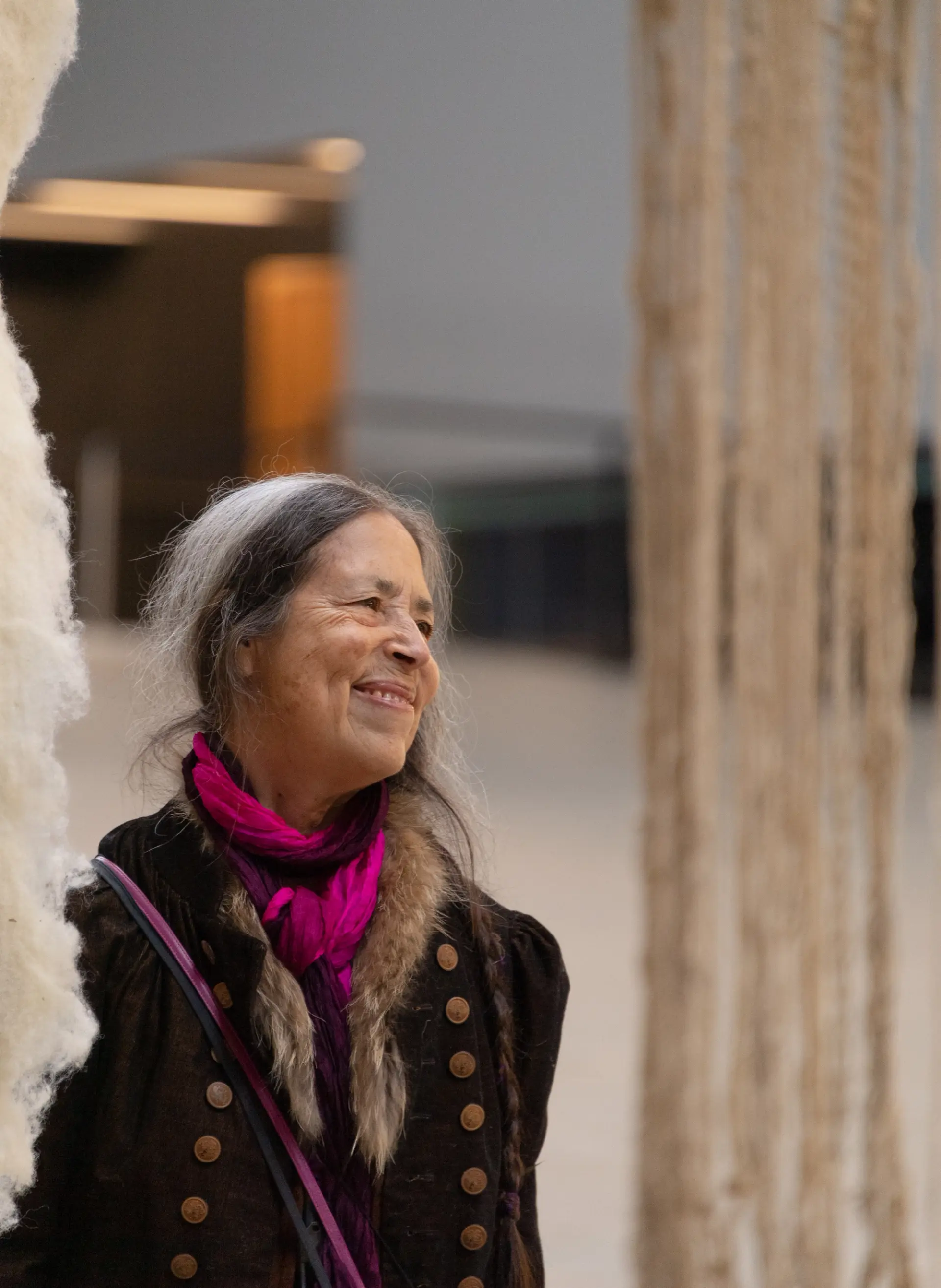 The artist looking into the distance at the Hyundai Commission installation at Tate Modern 2022.