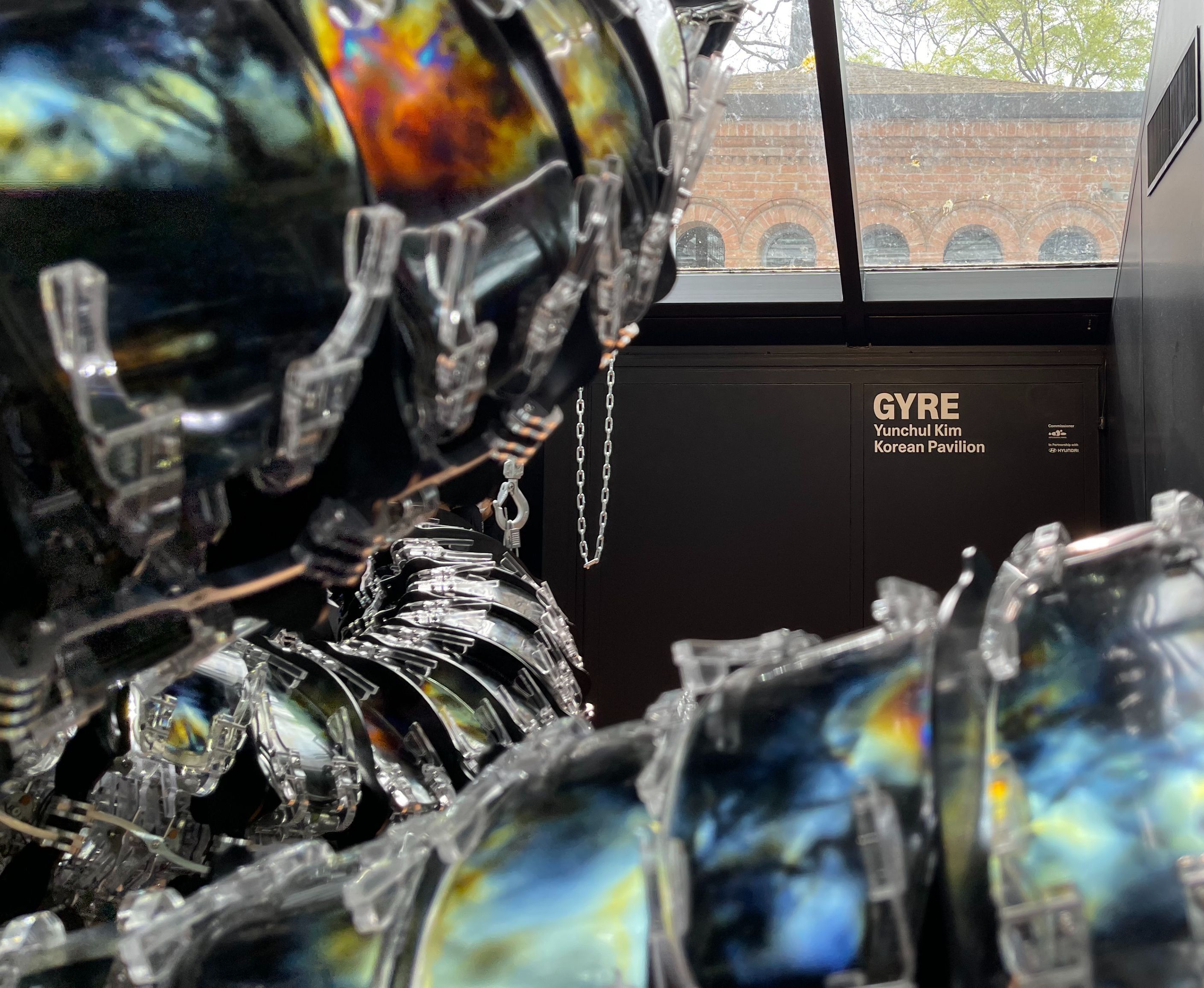 An upclose installation fragment next to a sign reading "GYRE: Yunchul Kim".