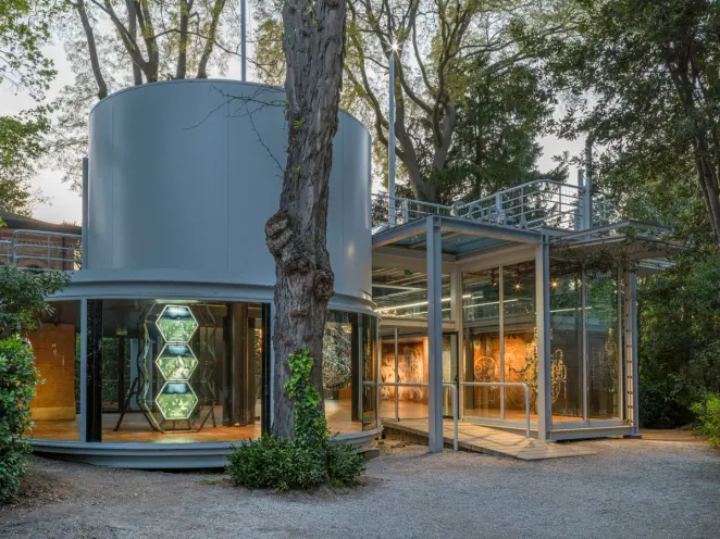 Outdoor view of the Korean Pavilion architecture showcasing cylindrical and square exhibition rooms, separated by a distin...