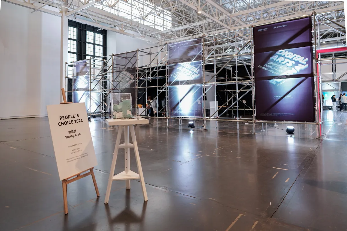 A spacious gallery hall featuring event posters from the Hyundai Art+Tech Digital Arts Festival on display.